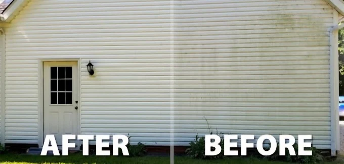 Client before-and-after photo of white vinyl siding cleaned on a residential exterior